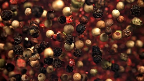 Colorful peppercorns swirling for flavorful culinary spice