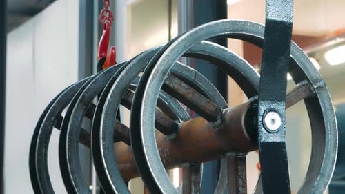 Hook of Crane with Chains Lifting Big Metal Unit After Welding In