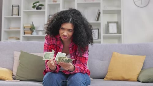 Woman Counting Money and Facing Financial Difficulties