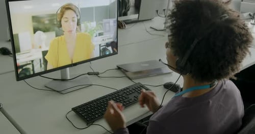 Businesswoman in Office on Video call to Client using Computer Technology