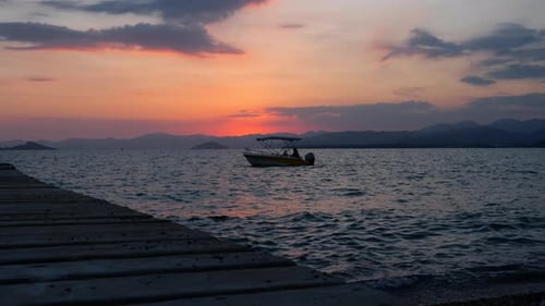 Tranquil Boat at Sunset on Gentle Waves