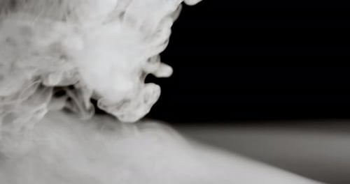 Wispy White Smoke on Black Background