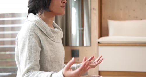 Woman Practicing Yoga at Home for Mindfulness