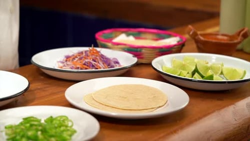 Fried shrimps falling on top of tortilla for taco baja california style