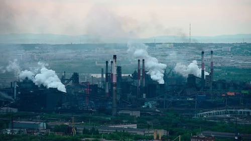 Factory Pipes Producing Dirty Smoke Clouds