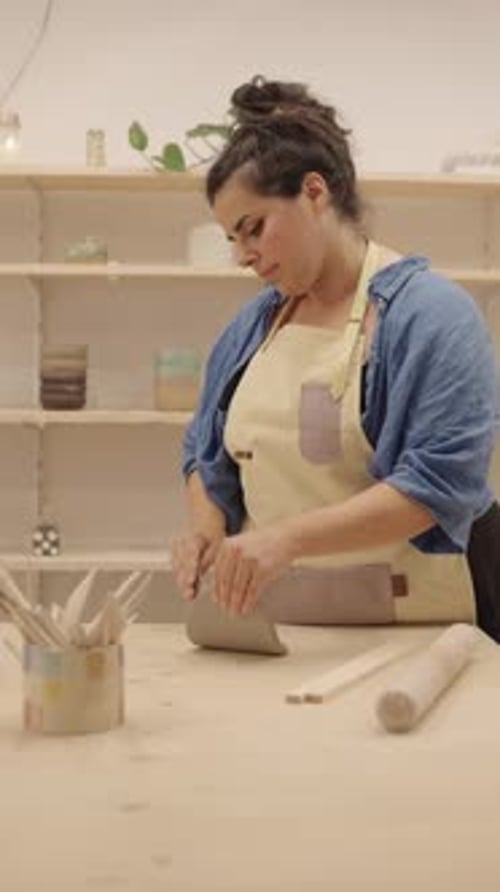 Ceramist Preparing Clay in Workshop