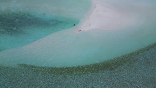 Young Couple Relaxing at Tropical Beach