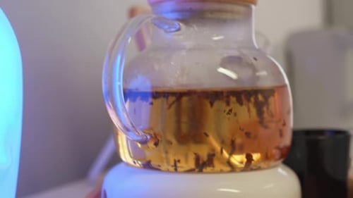Tea Brewing in Glass Pot in Home