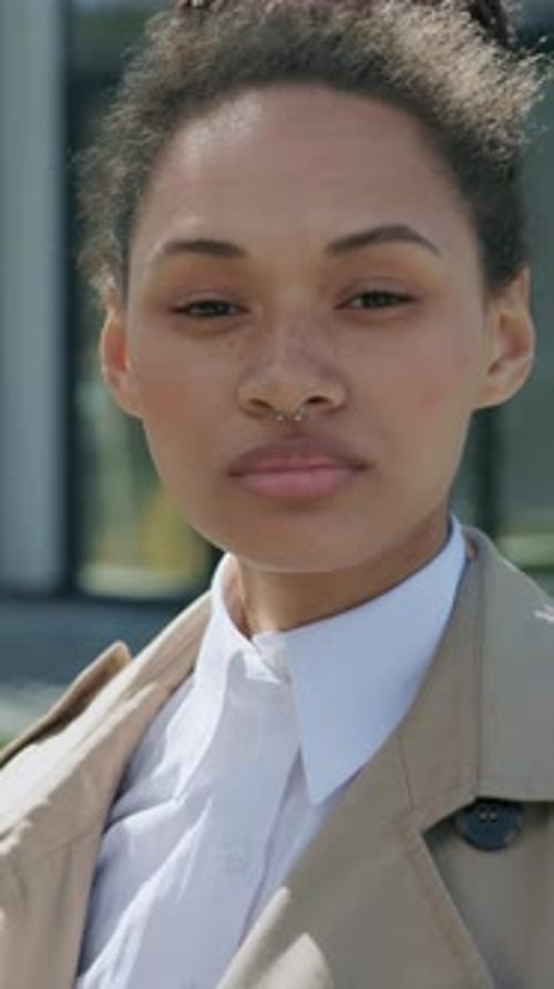 Close Up Attractive Mixed Race Woman Face Look at Camera Confident Near Business Center Serious