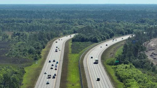 View From Above of American Wide Freeway in Florida with Dense Traffic of Driving Cars During Rush