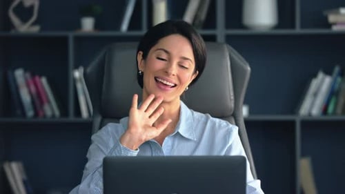 Engaging woman in virtual meeting from home office