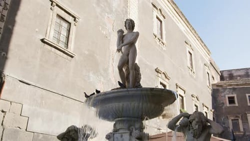Ancient Fountain with Water Spraying in Catania Sicily
