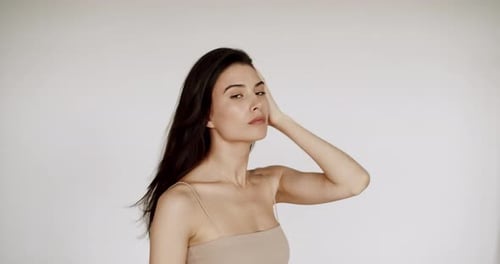 Woman With Long Brown Hair Posing Indoors
