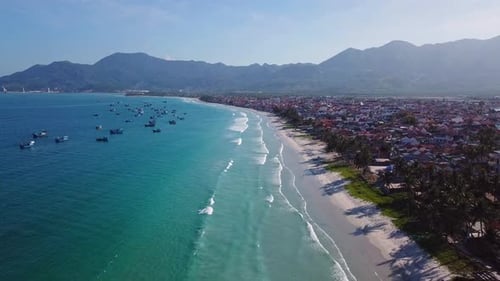 Aerial Footage of Different Multicoloured Fishing Boats in Blue Ocean Water
