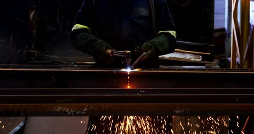 Male Engineer Using Welding Torch