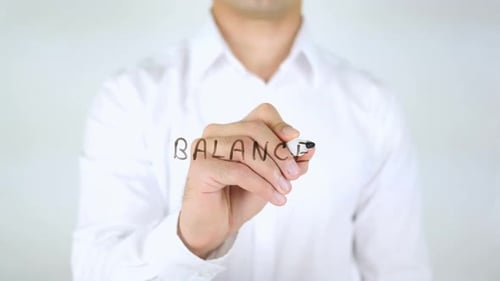 Hand Writes Balance on Clear Screen