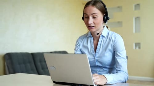 Woman Wear Headset Communicating By Conference Call Speak Looking at Computer at Home Office, Video