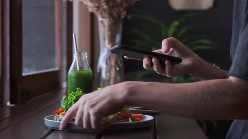 Popular Hipster Lifestyle and Food Blogger Taking Snaps of Healthy Vegan Meal Vegan Influencer in