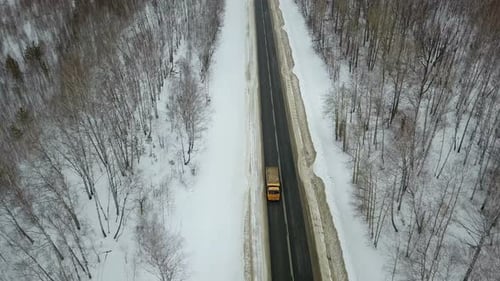 A Dump Truck Tipper On The Winter Road