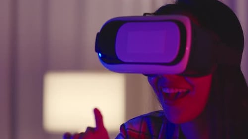 Young Adult Immersed in Virtual Reality Experience