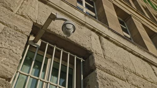 Surveillance Camera on Stone Building