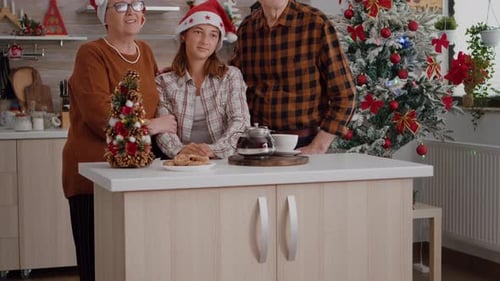 Family Posing in Kitchen with Christmas Decorations