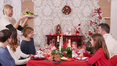 Family Celebrates Christmas Dinner at Home