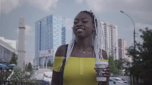Stylish Woman with Coffee in the City