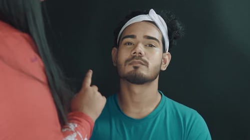 Young Adult Getting Makeup Applied at Home