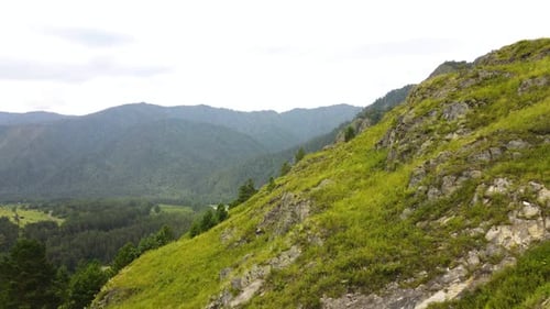 Mountain Range Against the Backdrop of a Summer Landscape with a River