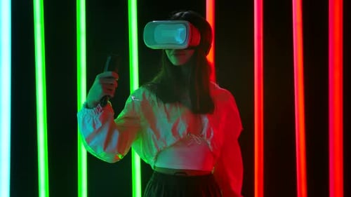 Portrait of a Pretty Young Beautiful Woman with Virtual Reality Goggles. Slow Motion.
