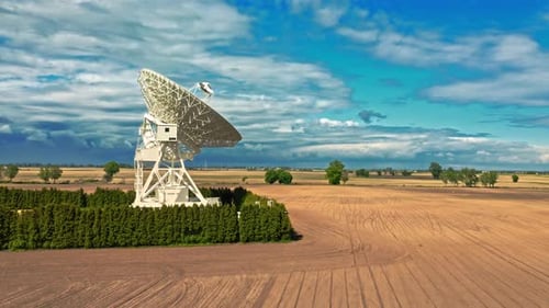 Satellite Dish Antenna in a Rural Field