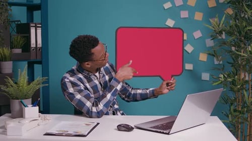 Man Presents Speech Bubble During Video Conference
