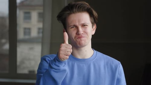 Portrait of Young Caucasian Guy Millennial Male Model Teen Wears Blue Sweatshirt Standing Alone