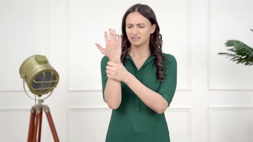 Young Woman Experiencing Wrist and Hand Pain