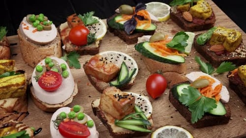 Appetizing Assortment of Open-Faced Sandwiches on Wooden Board