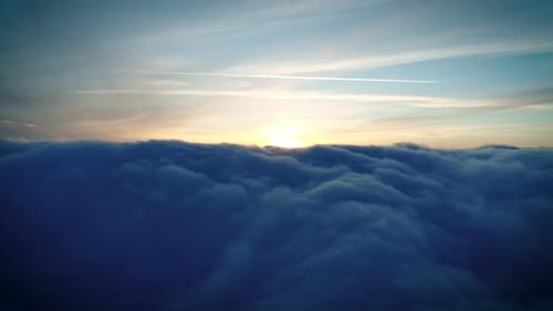 Majestic Aerial View of Clouds at Sunset