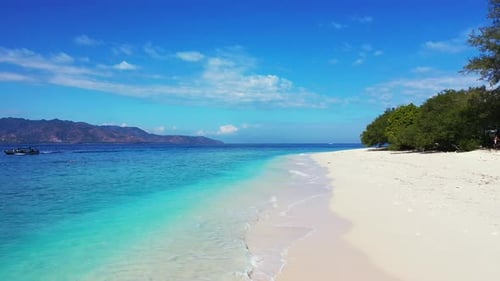 Vivid colors of beautiful seascape with blue azure sea washing white sand of exotic beach of tropica