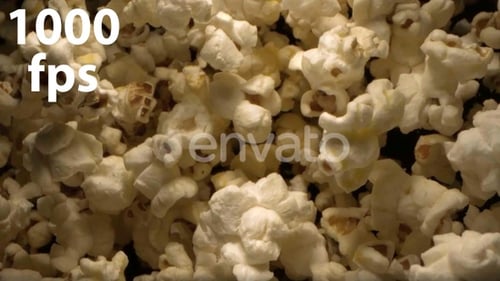Popcorn Tossed Up In The Air Against Black Background An Overhead Shot 4K