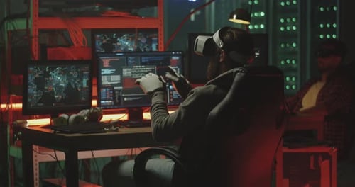 Man Uses VR Headset and Robotic Gloves