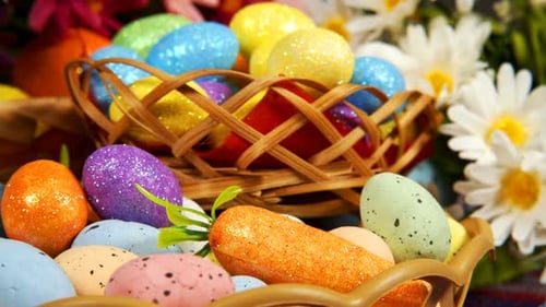 Easter Eggs and Spring Flowers in Decorative Baskets