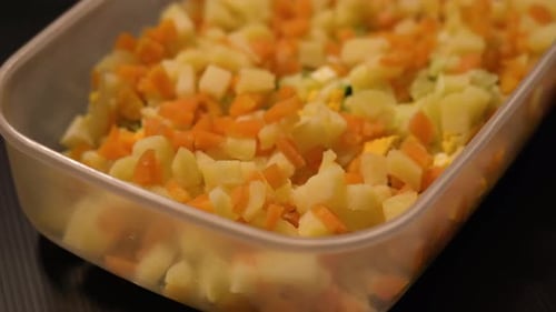 Salad in the Foreground of Carrots and Potatoes