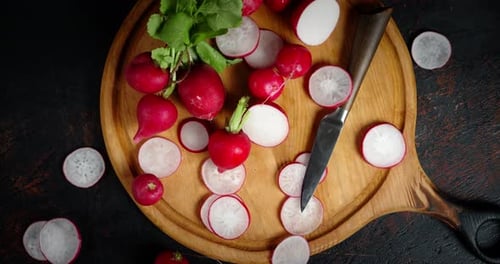 Fresh Radishes with Knife on Wooden Board