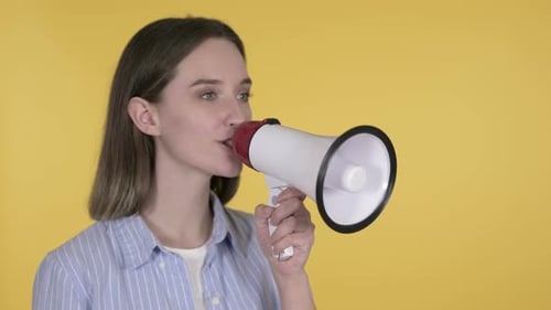 Woman Speaks Into Megaphone on Yellow Background