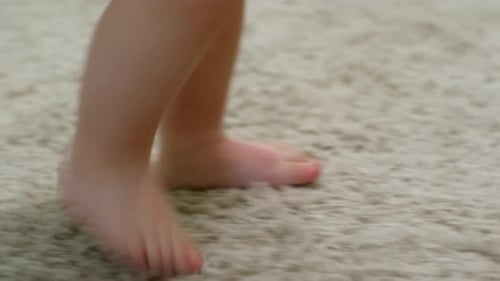 Barefoot Toddler Walking Unaided at Home