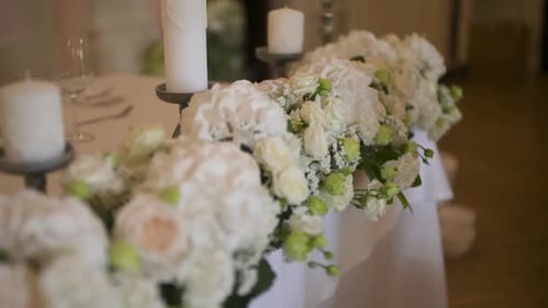Wedding Table with Flowers and Candles Decoration