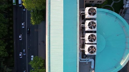 Aerial View of City Street and Building Rooftop