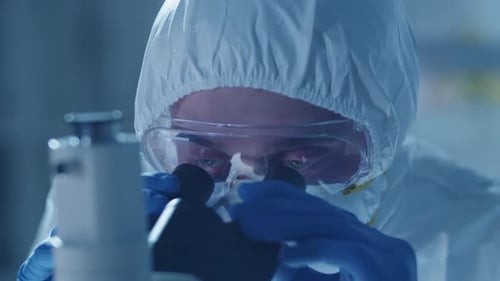 Scientist Using Microscope in a Laboratory Close-up