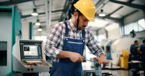 Industrial Factory Employee Working in Metal Manufacturing Industry