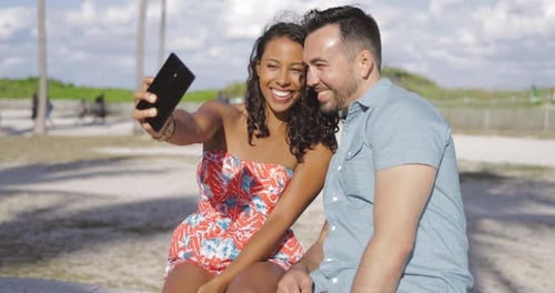 Couple Taking Selfie at a Beach on Sunny Day
